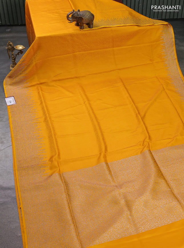 Banarasi semi katan silk saree mustard yellow with allover self emboss and zari woven border