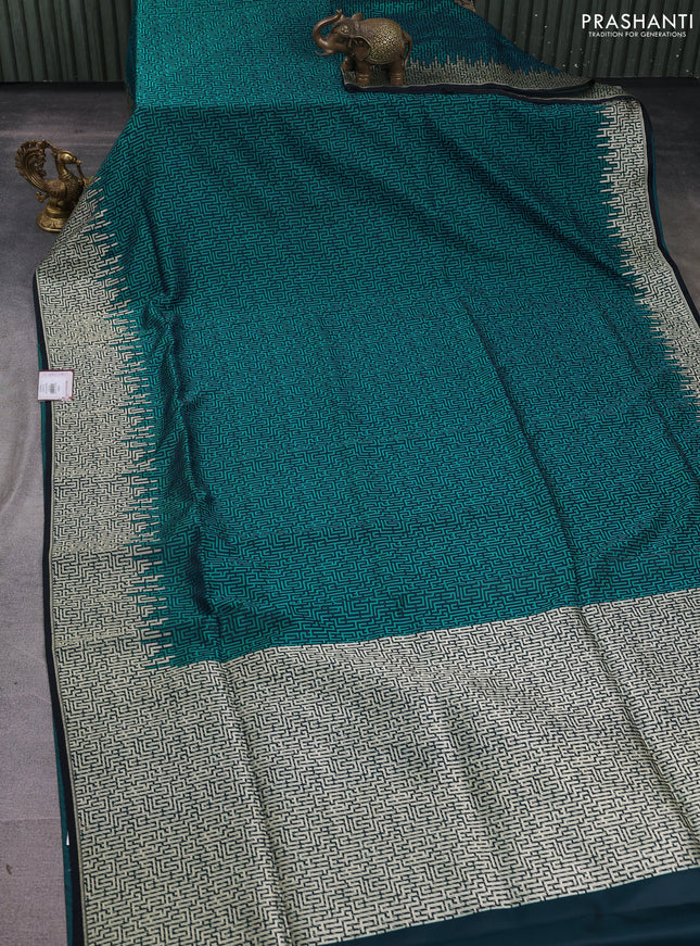 Banarasi semi katan silk saree black and teal green with allover self emboss and zari woven border