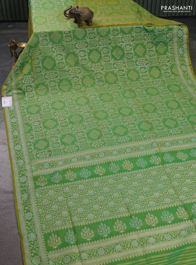 Banarasi semi katan silk saree light green with allover silver & gold zari woven buttas and zari woven border