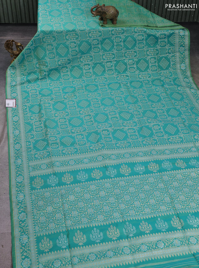 Banarasi semi katan silk saree dual shade of teal green with allover silver & gold zari woven buttas and zari woven border