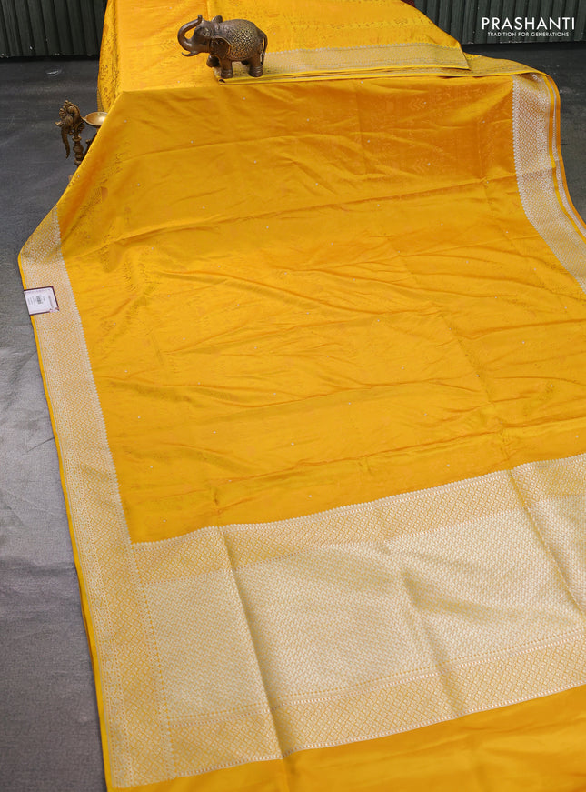 Banarasi semi katan silk saree yellow with allover self emboss and copper zari woven border