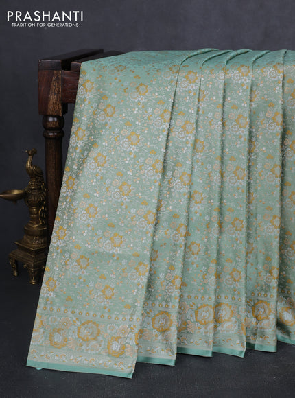Banarasi semi katan silk saree pastel green with allover thread brocade weaves and thread woven border