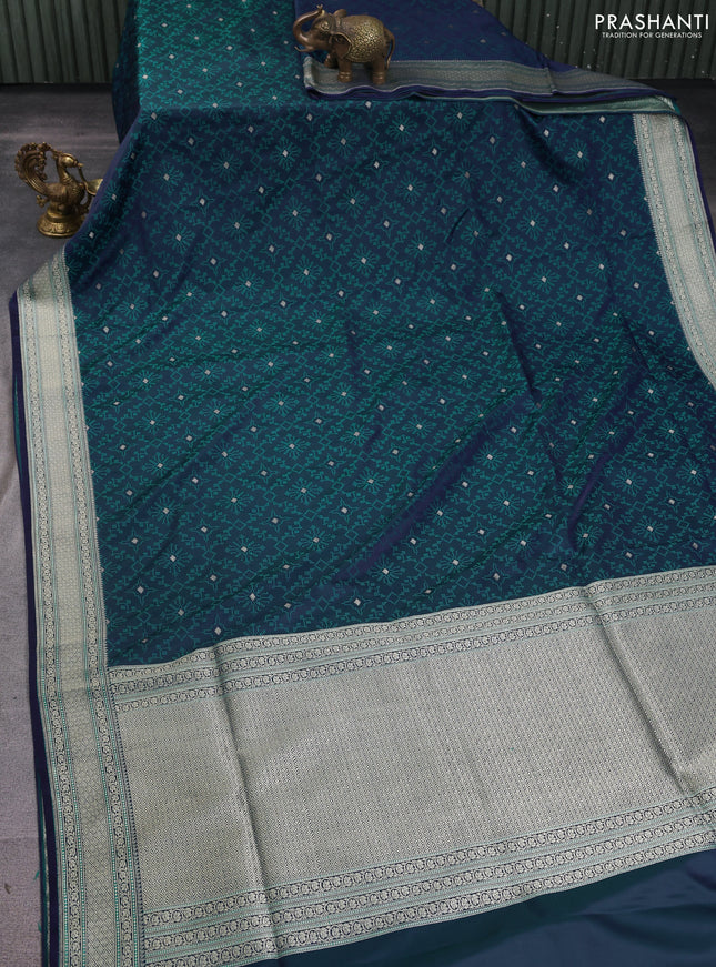 Banarasi semi katan silk saree dual shade of violet and teal green with allover self emboss & zari buttas and zari woven border