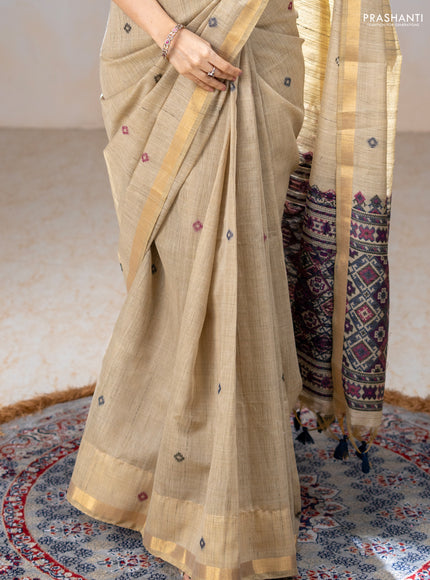 Linen cotton saree beige and purple blue with thread woven buttas and patola weaving pallu