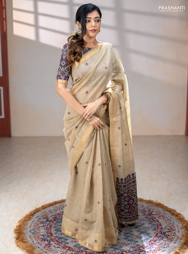 Linen cotton saree beige and purple blue with thread woven buttas and patola weaving pallu