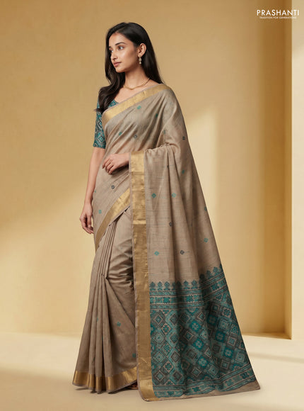Linen cotton saree beige and teal green with thread woven buttas and patola weaving pallu