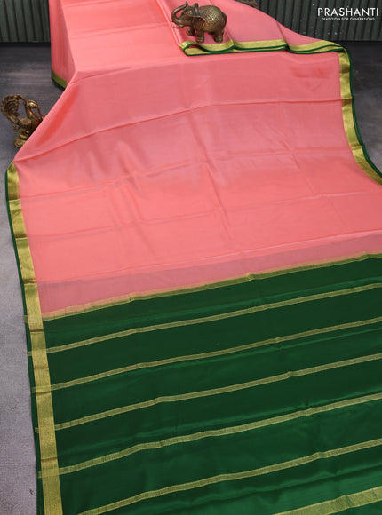Pure mysore silk saree peach shade and green with plain body and zari woven border