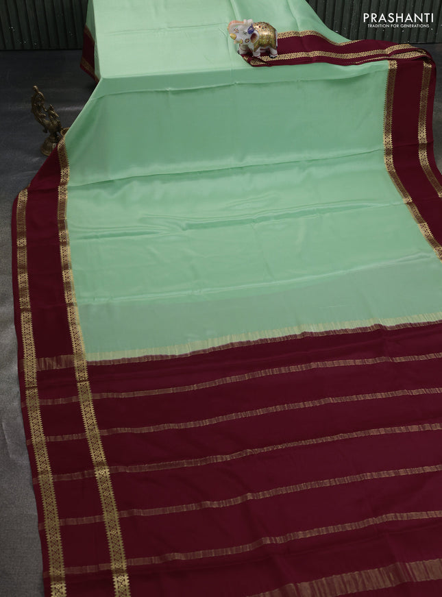 Pure mysore silk saree pista green and maroon with plain body and rettapet zari woven border