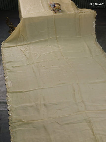 Satin organza silk saree cream and black with mirror embroidery work and ajrakh printed blouse