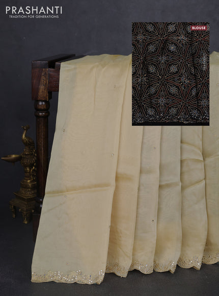 Satin organza silk saree cream and black with mirror embroidery work and ajrakh printed blouse