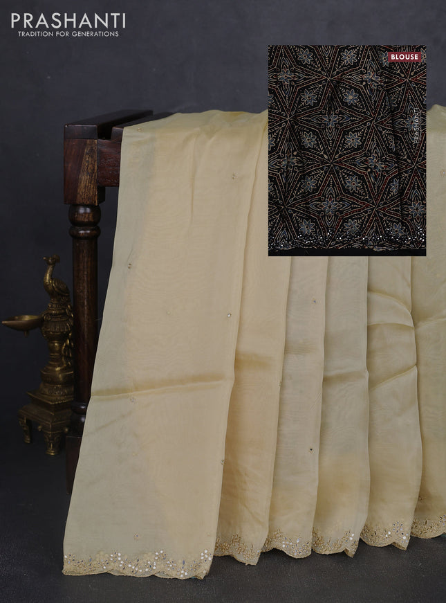 Satin organza silk saree cream and black with mirror embroidery work and ajrakh printed blouse