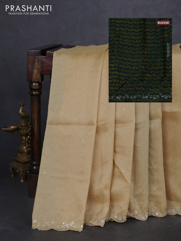 Satin organza silk saree beige and bottle green with mirror embroidery work and ajrakh printed blouse