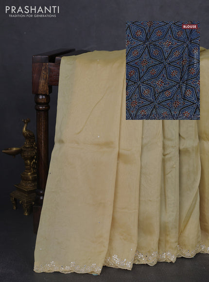 Satin organza silk saree cream and indigo blue with mirror embroidery work and ajrakh printed blouse