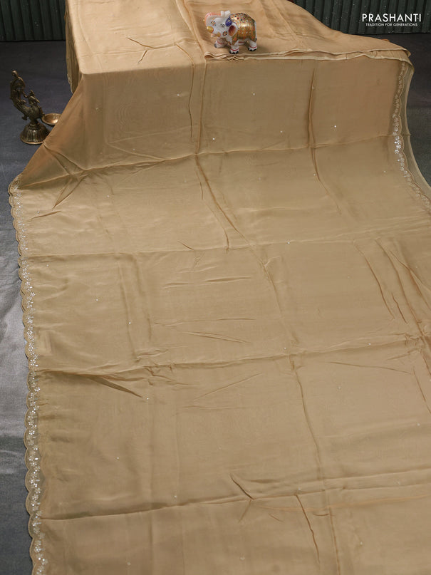 Satin organza silk saree beige and indigo blue with mirror embroidery work and ajrakh printed blouse