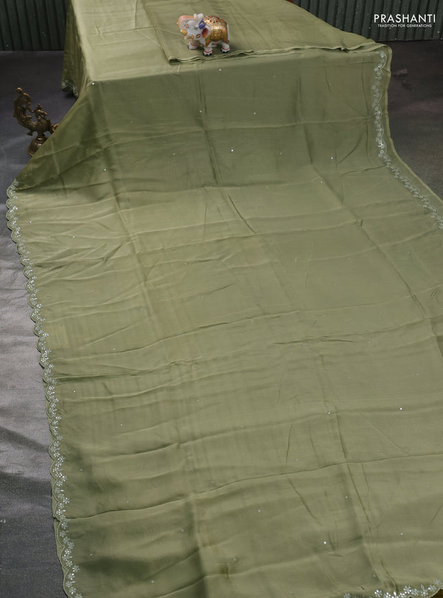Satin organza silk saree pastel green and mustard yellow with mirror embroidery work and ajrakh printed blouse