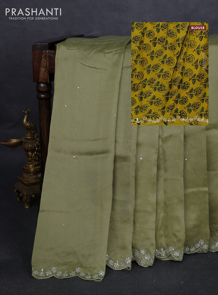 Satin organza silk saree pastel green and mustard yellow with mirror embroidery work and ajrakh printed blouse