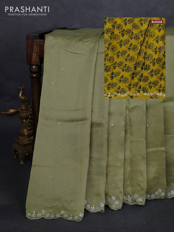 Satin organza silk saree pastel green and mustard yellow with mirror embroidery work and ajrakh printed blouse