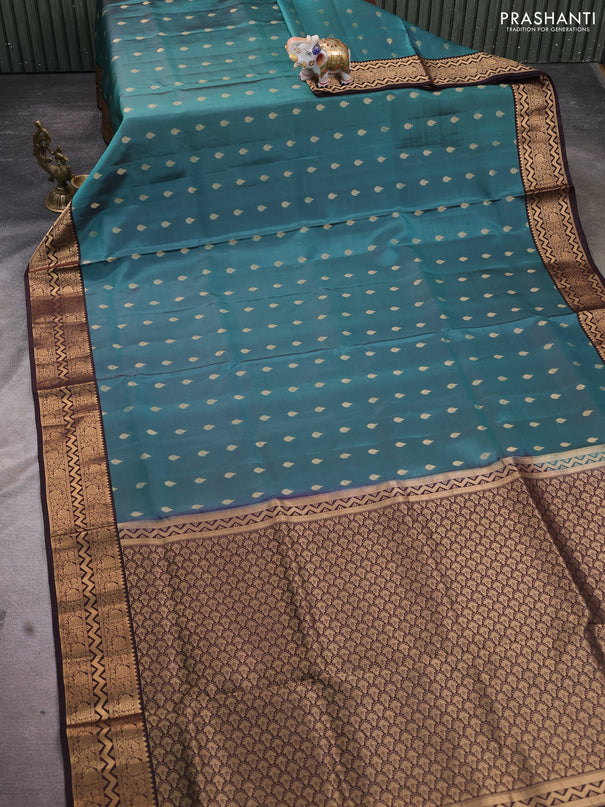 Pure soft silk saree pastel shade of blue and coffee brown with allover zari woven buttas and zari woven border