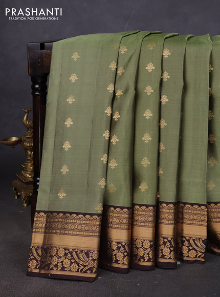 Pure soft silk saree pastel green and coffee brown with allover zari woven buttas and zari woven border