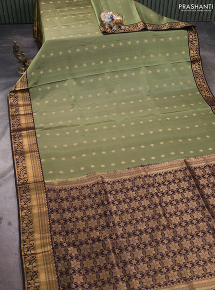 Pure soft silk saree pastel green and coffee brown with allover zari woven buttas and zari woven border
