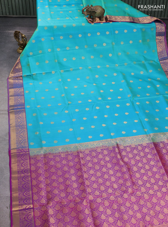 Pure soft silk saree teal blue shade and magenta pink with allover zari woven buttas and zari woven border