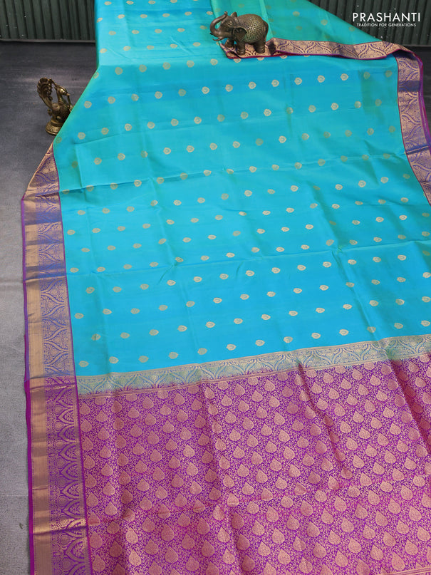 Pure soft silk saree teal blue shade and magenta pink with allover zari woven buttas and zari woven border