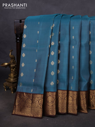 Pure soft silk saree teal blue shade and coffee brown with allover zari woven buttas and rich zari woven border