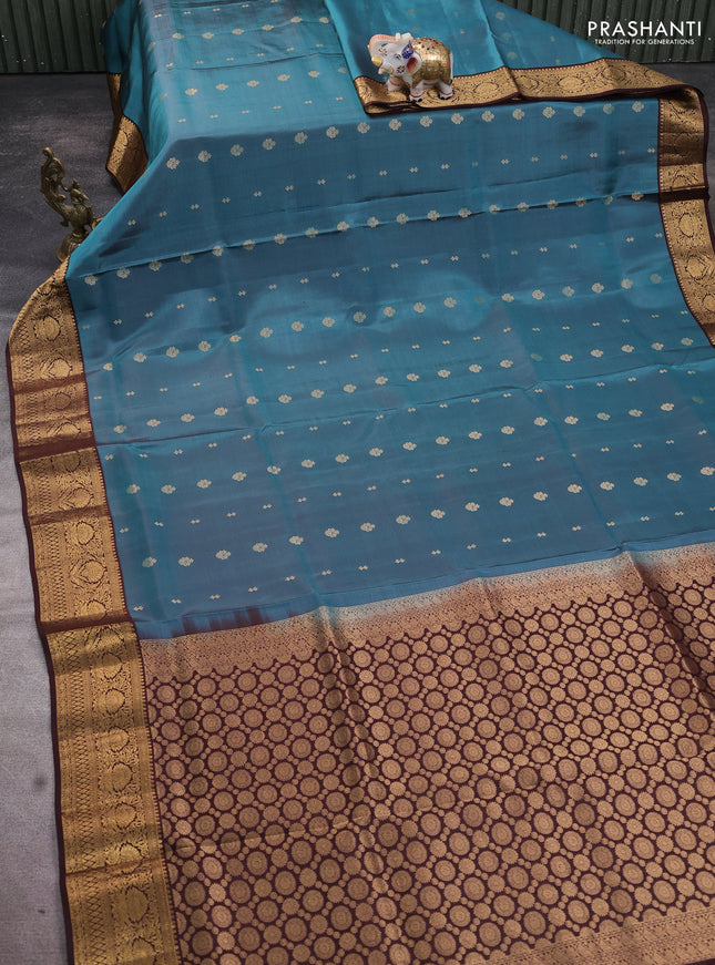 Pure soft silk saree teal blue shade and coffee brown with allover zari woven buttas and rich zari woven border
