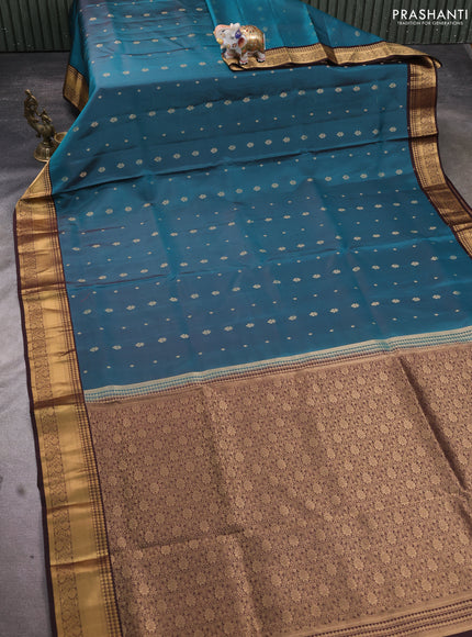 Pure soft silk saree peacock green and coffee brown with allover zari woven buttas and rich zari woven border