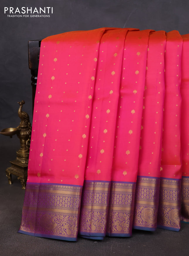 Pure soft silk saree dual shade of pinkish orange and teal green with allover zari woven buttas and zari woven annam border