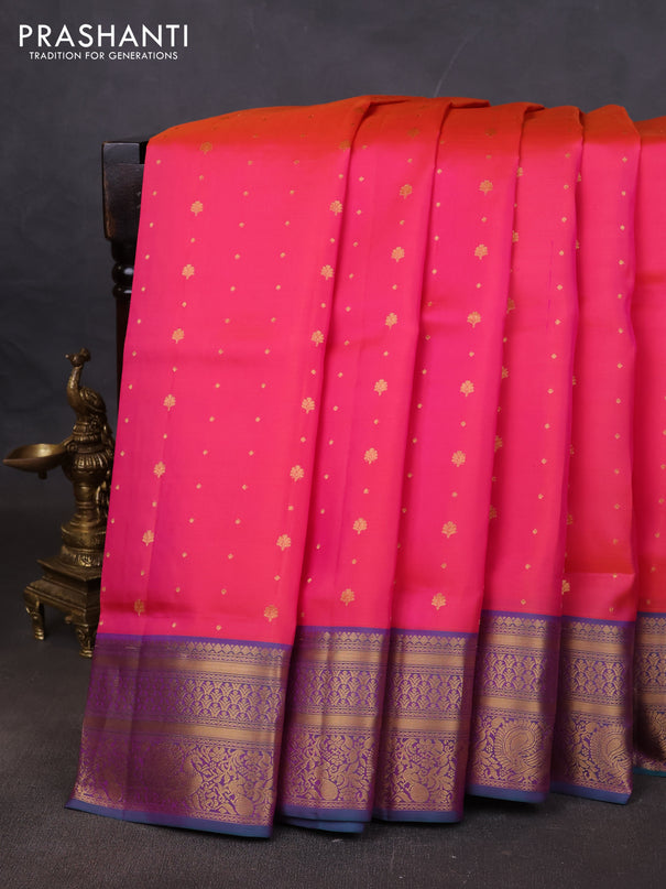Pure soft silk saree dual shade of pinkish orange and teal green with allover zari woven buttas and zari woven annam border