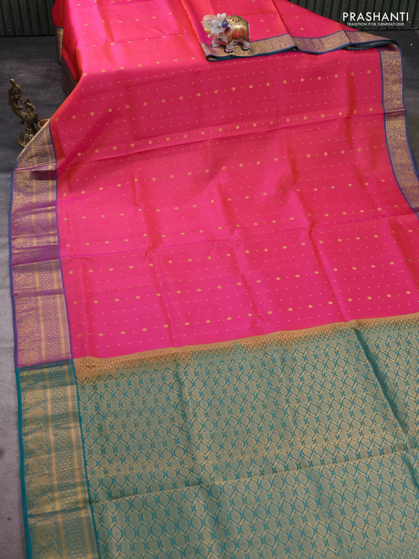 Pure soft silk saree dual shade of pinkish orange and teal green with allover zari woven buttas and zari woven annam border