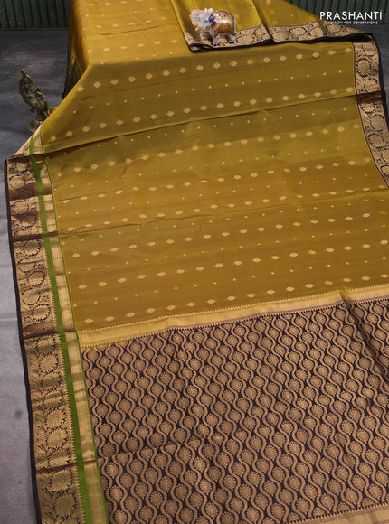 Pure soft silk saree mehendi green and coffee brown with allover zari woven buttas and zari woven floral border