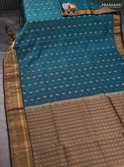 Pure soft silk saree peacock green and coffee brown with allover zari woven buttas and rich zari woven border