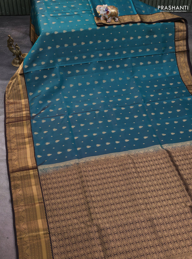Pure soft silk saree peacock green and coffee brown with allover zari woven buttas and rich zari woven border