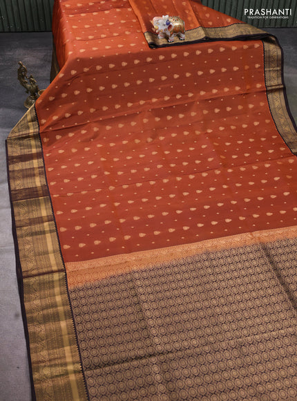 Pure soft silk saree rustic orange and coffee brown with allover zari woven buttas and rich zari woven border