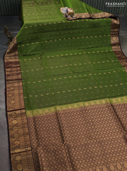 Pure soft silk saree green and coffee brown with allover zari woven buttas and rich zari woven border