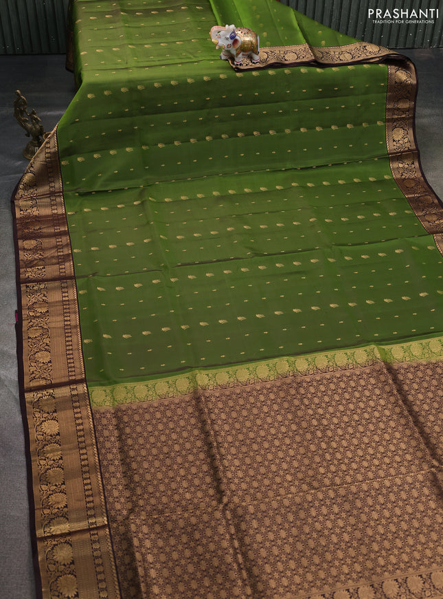 Pure soft silk saree green and coffee brown with allover zari woven buttas and rich zari woven border