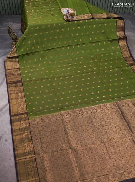 Pure soft silk saree green and coffee brown with allover zari woven buttas and rich zari woven border