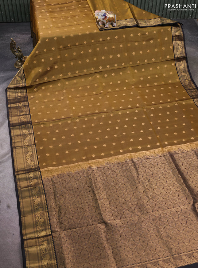 Pure soft silk saree mehendi green and black with allover zari woven buttas and rich zari woven border