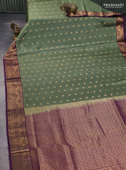 Pure soft silk saree pastel green and deep purple with allover zari woven buttas and rich zari woven border