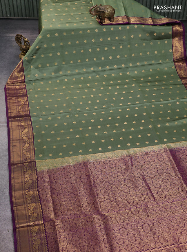 Pure soft silk saree pastel green and deep purple with allover zari woven buttas and rich zari woven border