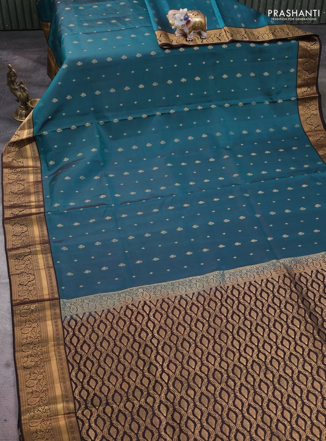 Pure soft silk saree peacock green and coffee brown with allover zari woven buttas and rich zari woven border