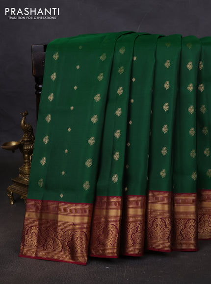 Pure soft silk saree green and dark magenta pink with allover zari woven buttas and rich zari woven border