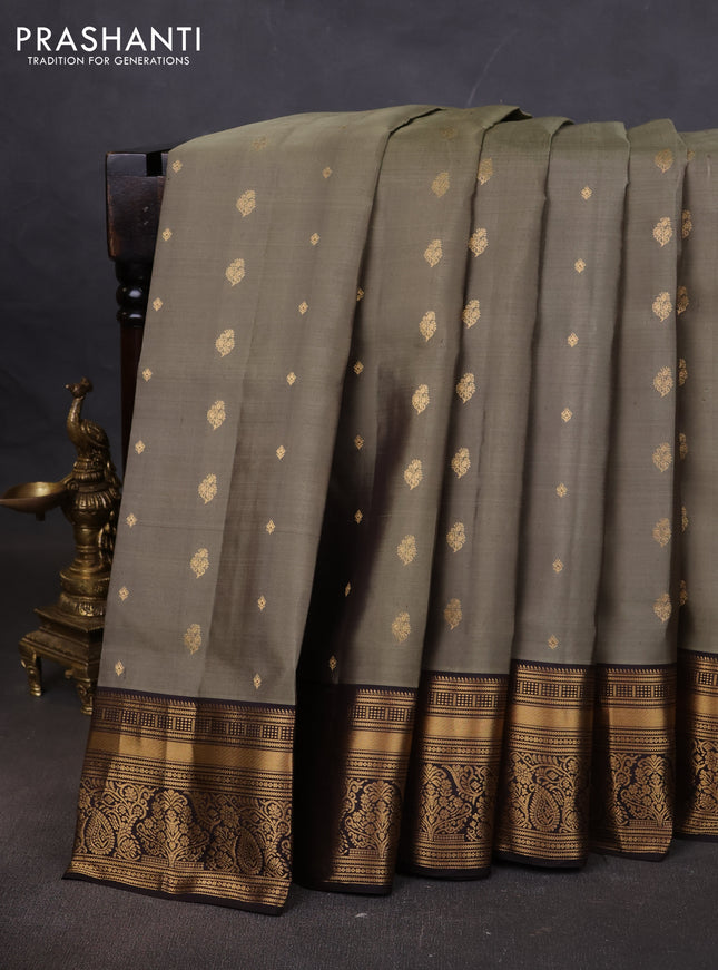 Pure soft silk saree elaichi green and coffee brown with allover zari woven buttas and rich zari woven border