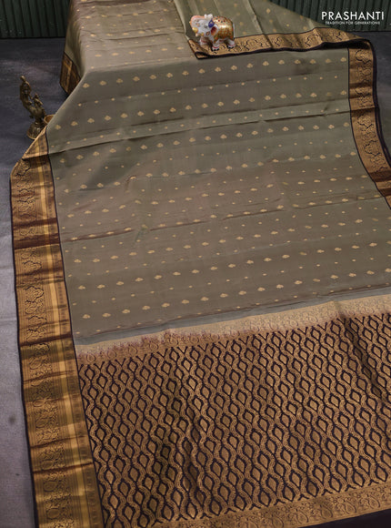 Pure soft silk saree elaichi green and coffee brown with allover zari woven buttas and rich zari woven border
