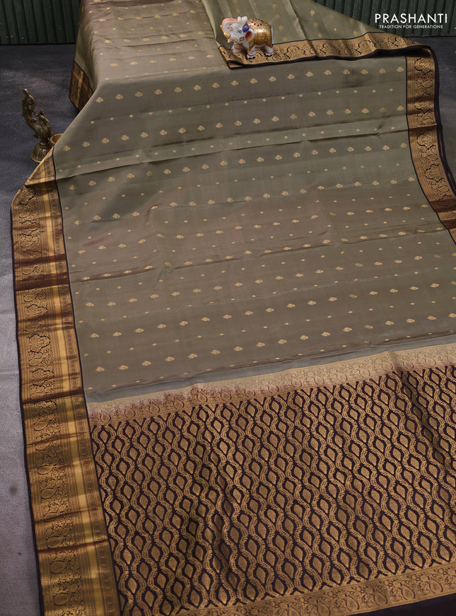 Pure soft silk saree elaichi green and coffee brown with allover zari woven buttas and rich zari woven border