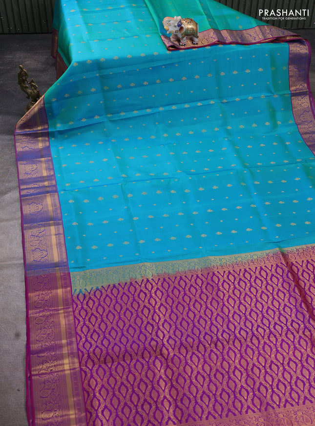 Pure soft silk saree dual shade of teal bluish green and purple with allover zari woven buttas and rich zari woven border