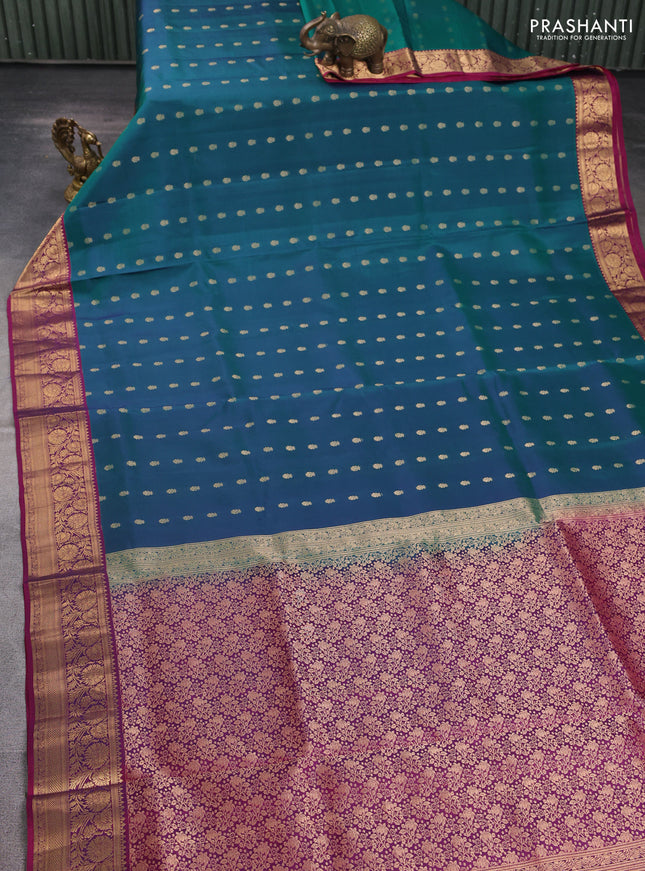 Pure soft silk saree dual shade of bluish green and purple with allover zari woven buttas and rich zari woven border