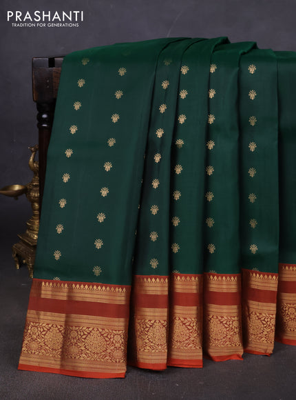 Pure soft silk saree bottle green and rustic orange with allover zari woven buttas and zari woven border